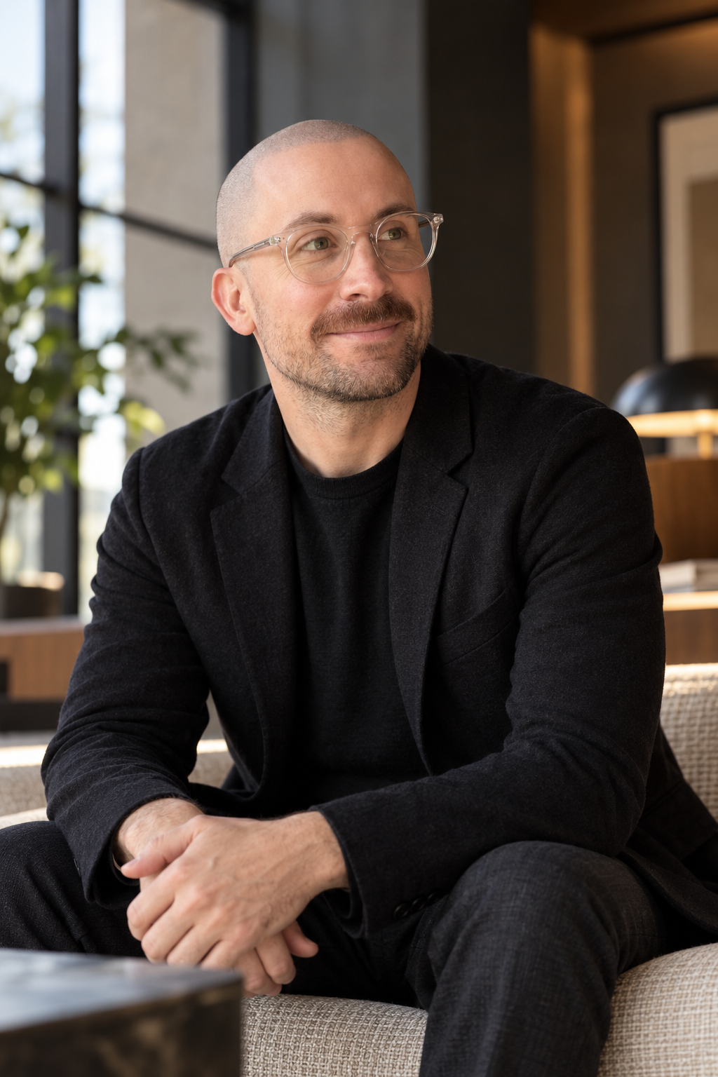 Chris Bookman seated in a warm modern interior